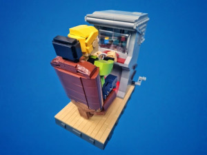 LEGO Automaton Arcade game - Race With Dave designed by Joost Schiphorst - figure playing Gran Turismo -Building Instructions available on Planet GBC